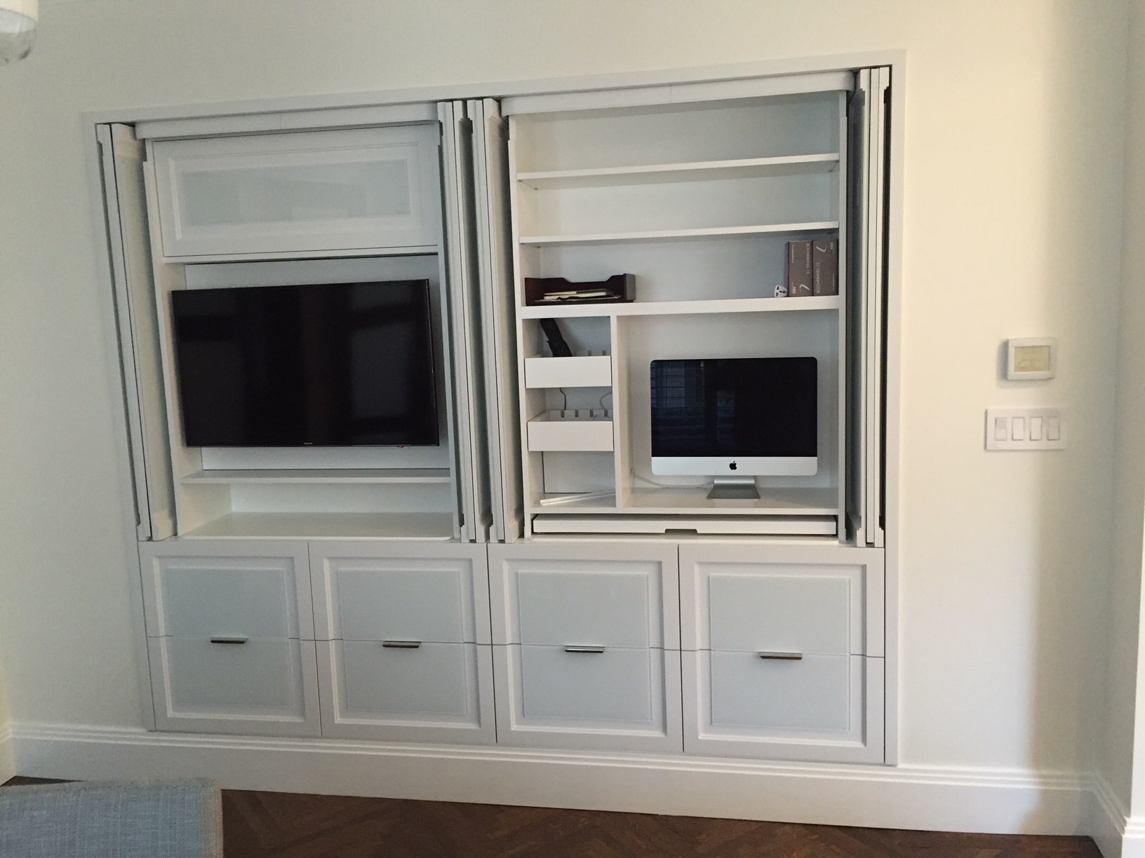 White built-in entertainment center with TV