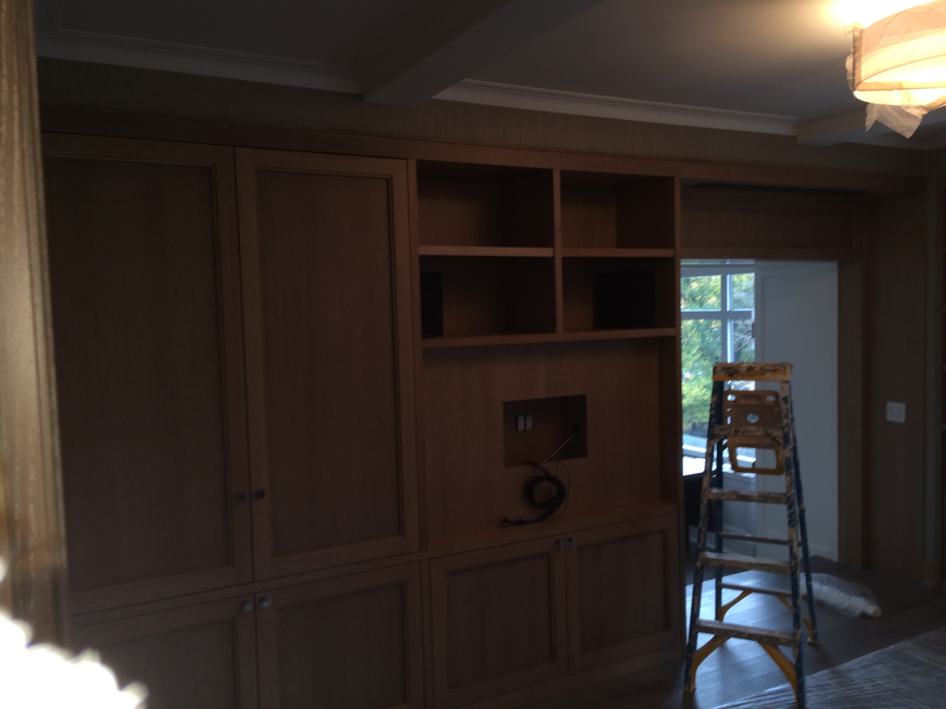 Built-in wooden shelving unit under construction